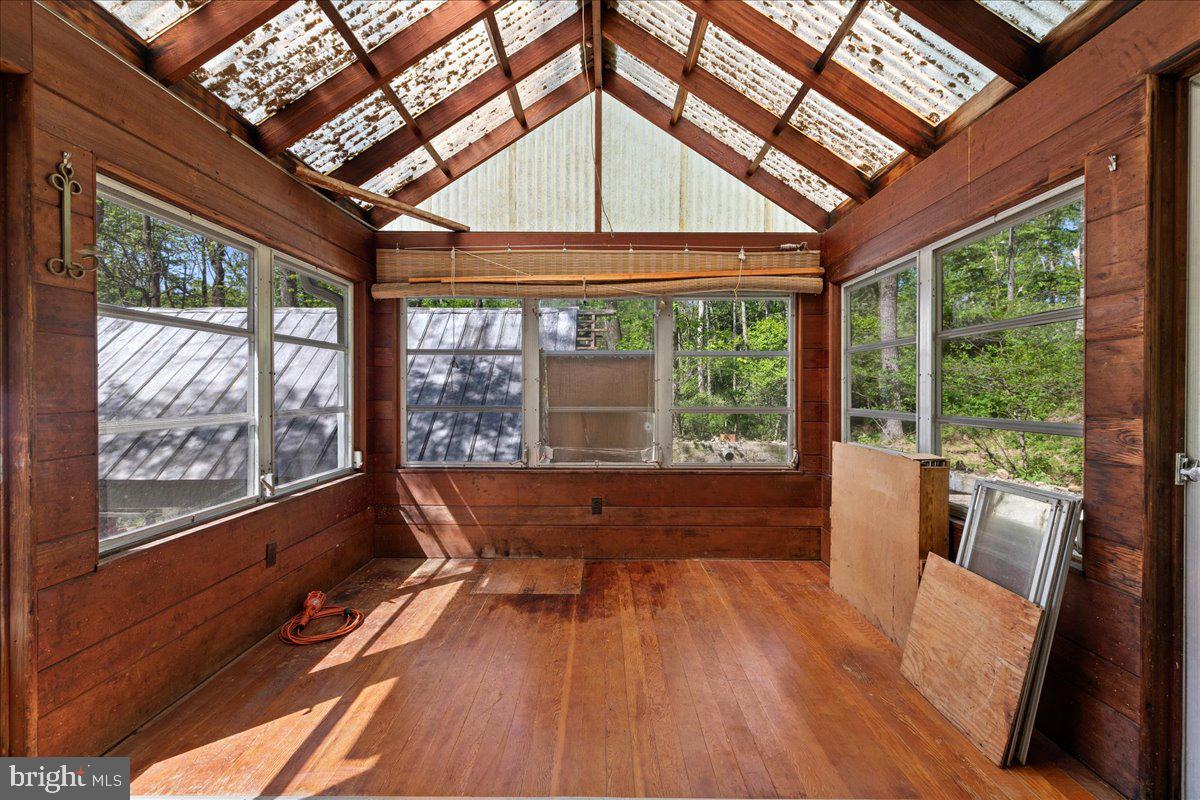 133 Woosamonsa Road Pennington, NJ 08534 - Photo 15 of 27 a living room with large windows and wooden floor