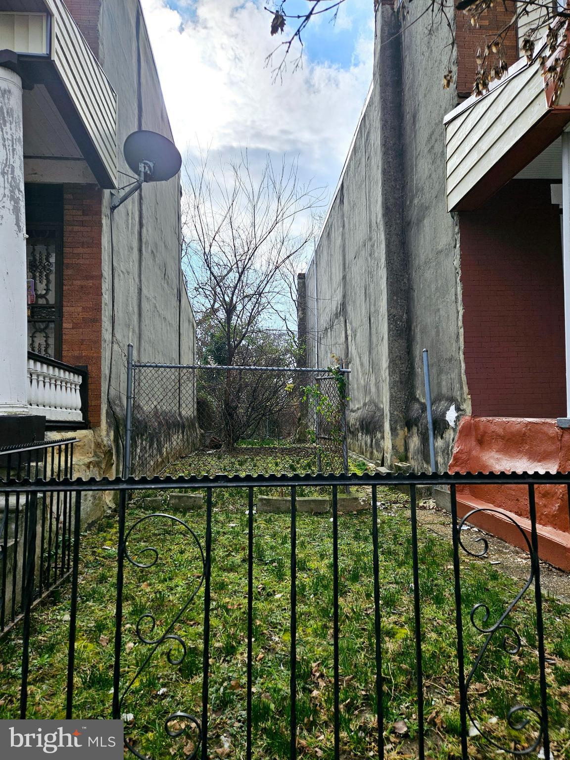 a view of a house with a fence