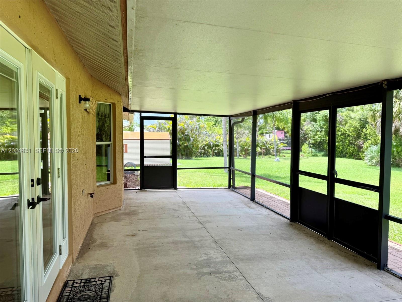 15819 76th Road North Loxahatchee, FL 33470 - Photo 31 of 45 a view of entryway with a floor to ceiling window