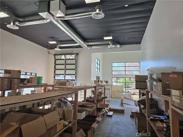 a roof deck with couches and wooden floor