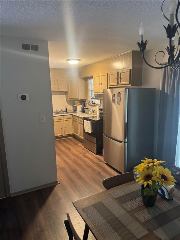 4701 Flat Shoals Road, Unit 41G Union City, GA 30291 - Photo 6 of 16 a kitchen with stainless steel appliances a refrigerator and a stove