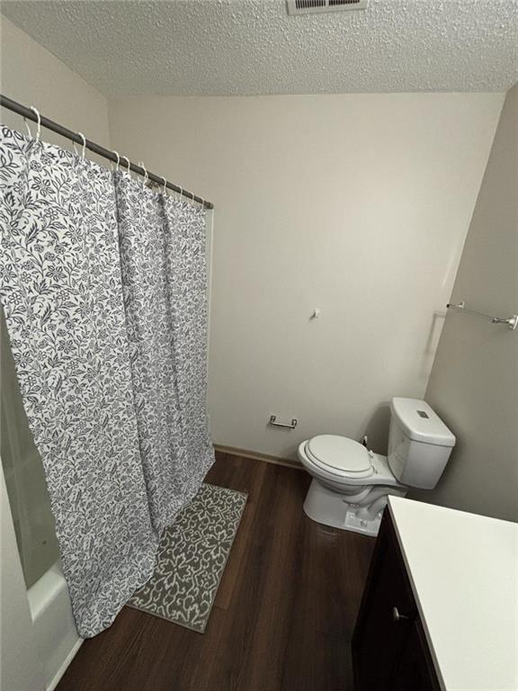 4701 Flat Shoals Road, Unit 41G Union City, GA 30291 - Photo 8 of 16 a bathroom with a toilet and a shower curtain