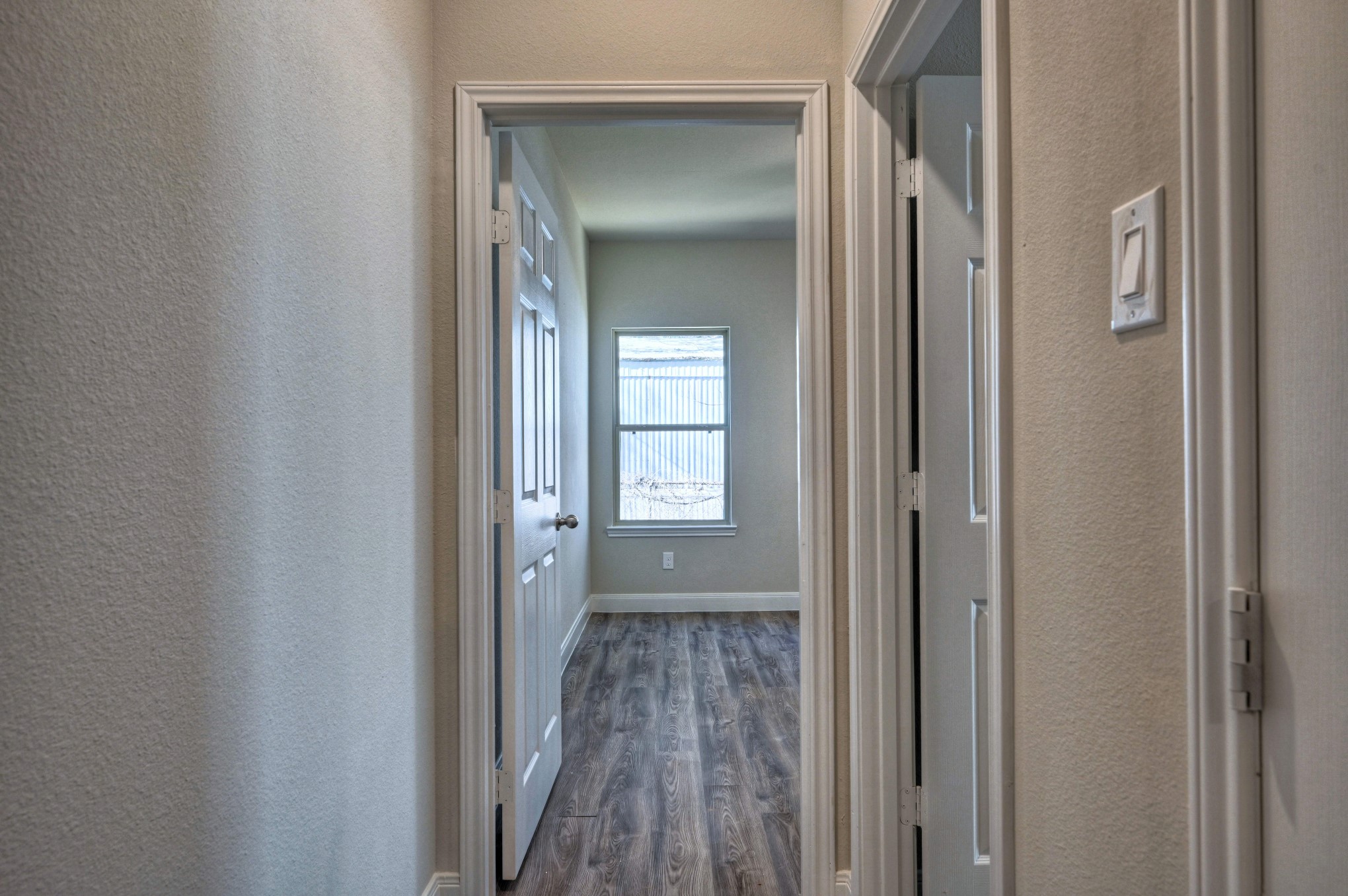 9173 Inwood Willis, TX 77318 - Photo 20 of 31 a view of a hallway with wooden floor