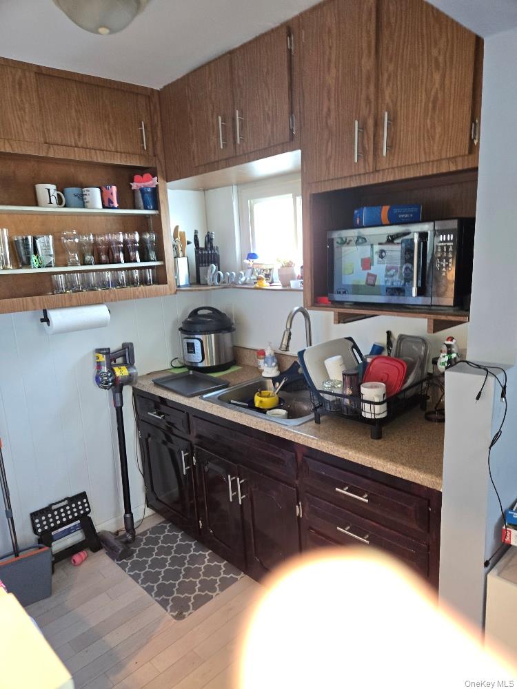 12 Carson Street Bethpage, NY 11714 - Photo 17 of 33 a kitchen with a sink and a stove top oven