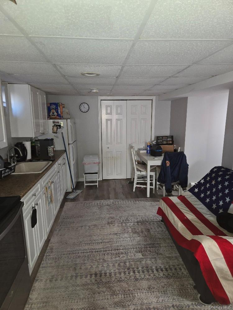 12 Carson Street Bethpage, NY 11714 - Photo 33 of 33 a living room with furniture gym equipment and a window