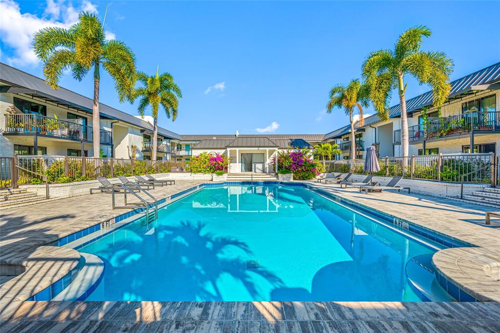 3909 West Cleveland Street Tampa, FL 33609 - Photo 2 of 12 a view of a swimming pool with a lounge chairs