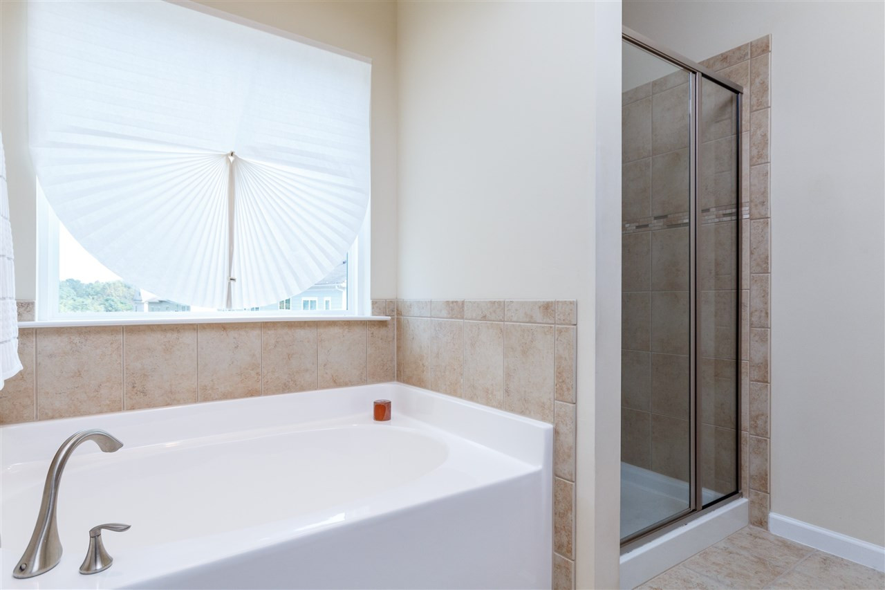 1305 Rodessa Run Raleigh, NC 27607 - Photo 18 of 25 Enjoy this master bathroom with garden tub, walk in shower, double sinks. Master Bathroom