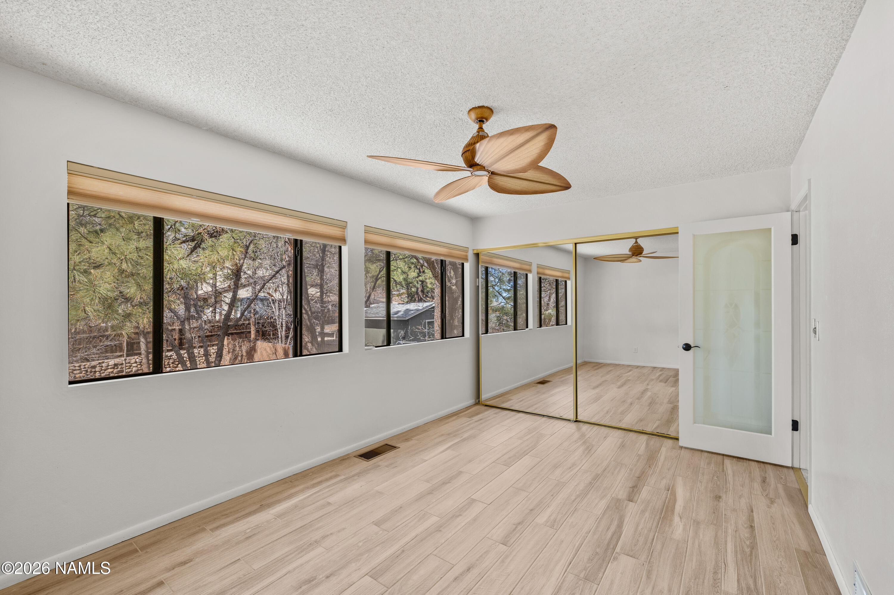 3971 North Swiss Road Flagstaff, AZ 86004 - Photo 21 of 43 a view of empty room with wooden floor and fan