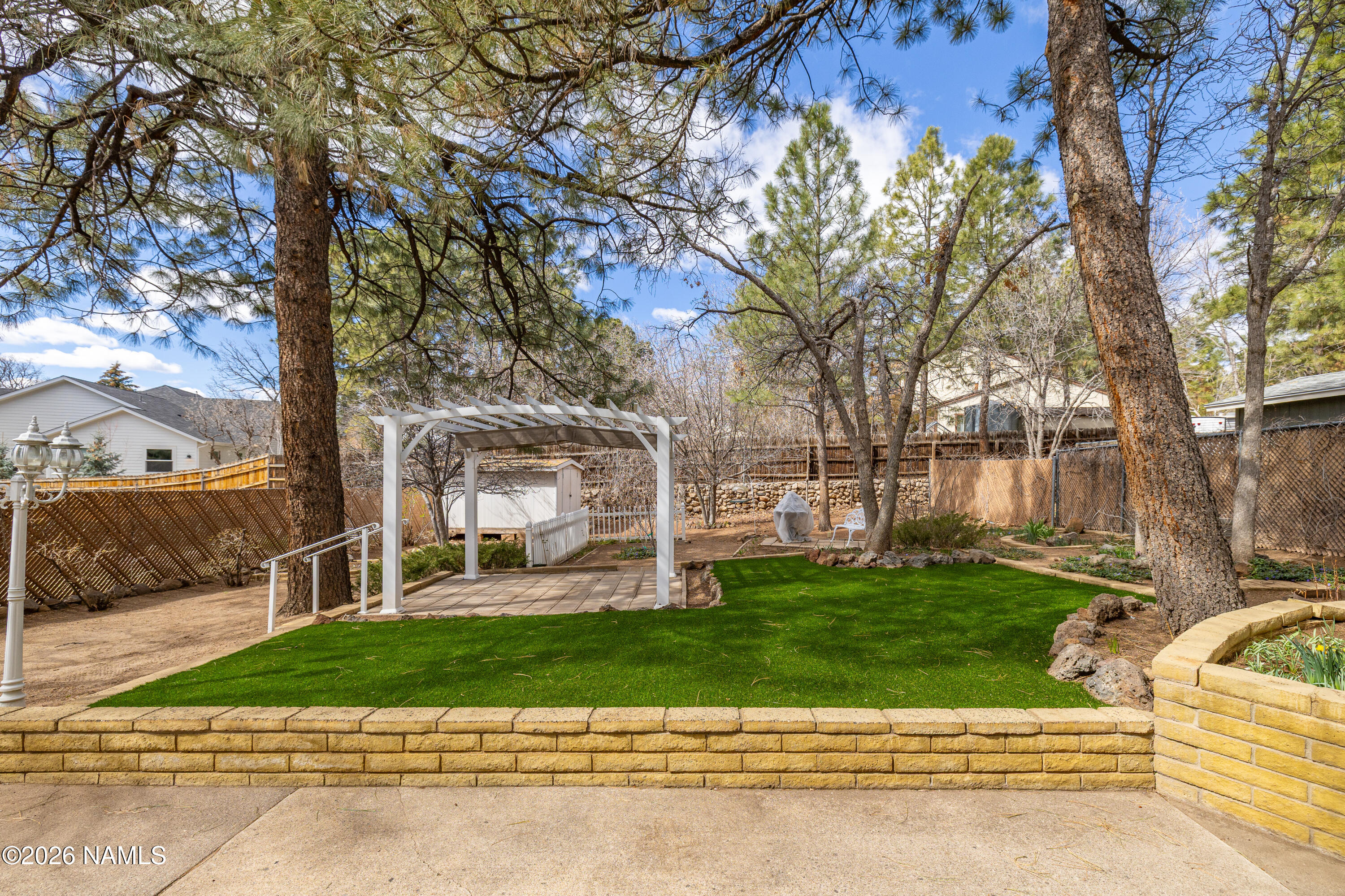 3971 North Swiss Road Flagstaff, AZ 86004 - Photo 30 of 43 front view of a house with a yard
