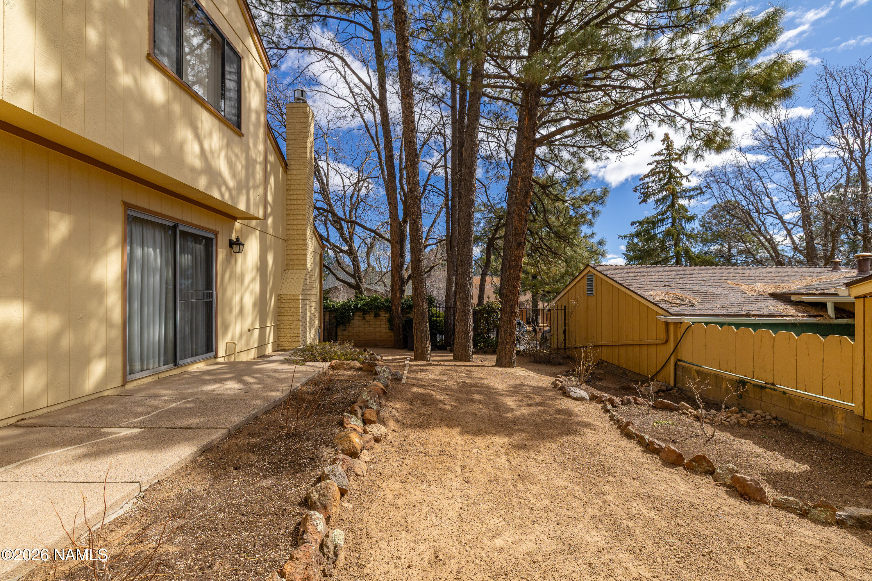 3971 North Swiss Road Flagstaff, AZ 86004 - Photo 33 of 43 a view of a house with a tree in front