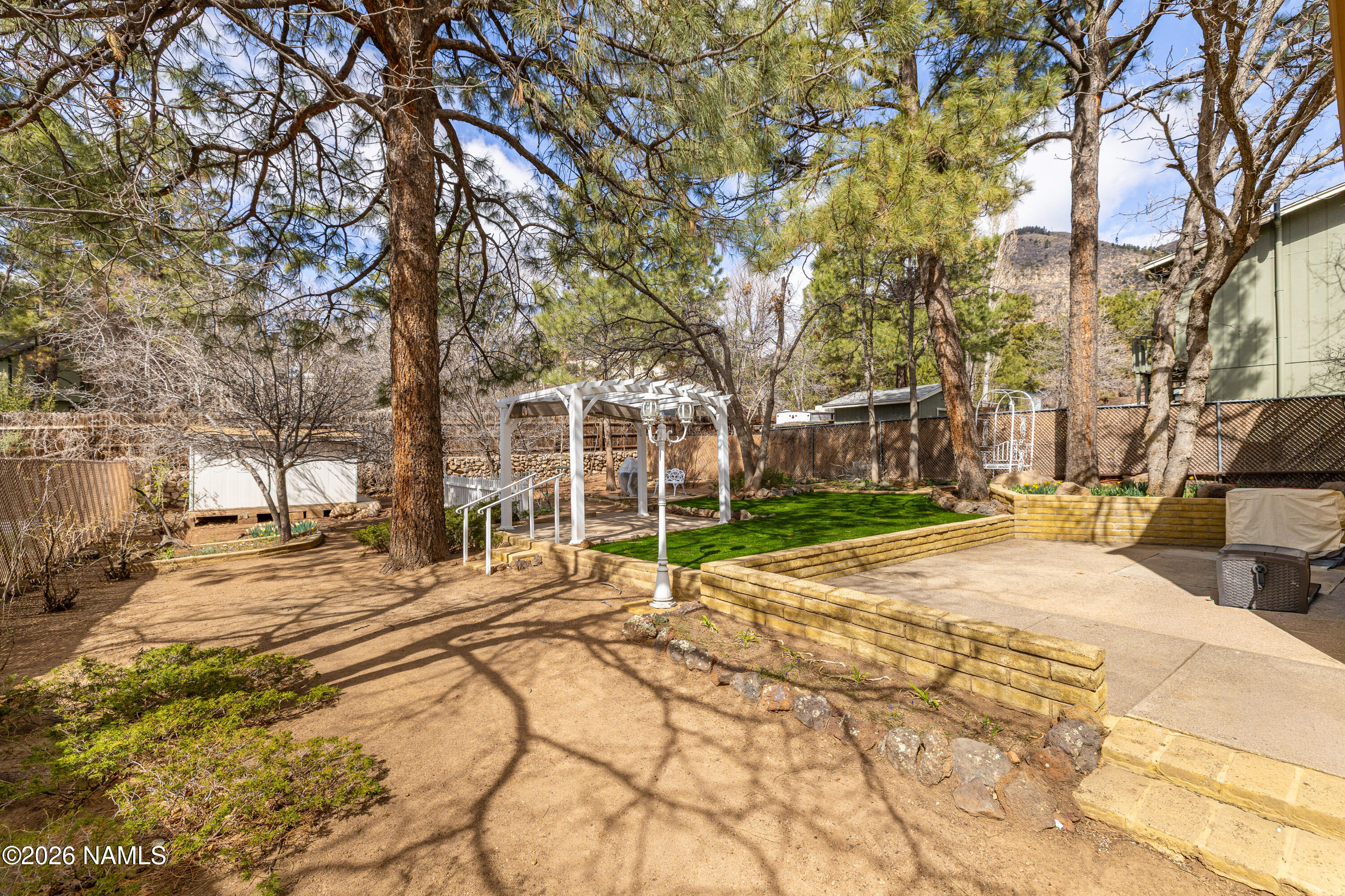 3971 North Swiss Road Flagstaff, AZ 86004 - Photo 34 of 43 a view of a yard with plants and trees