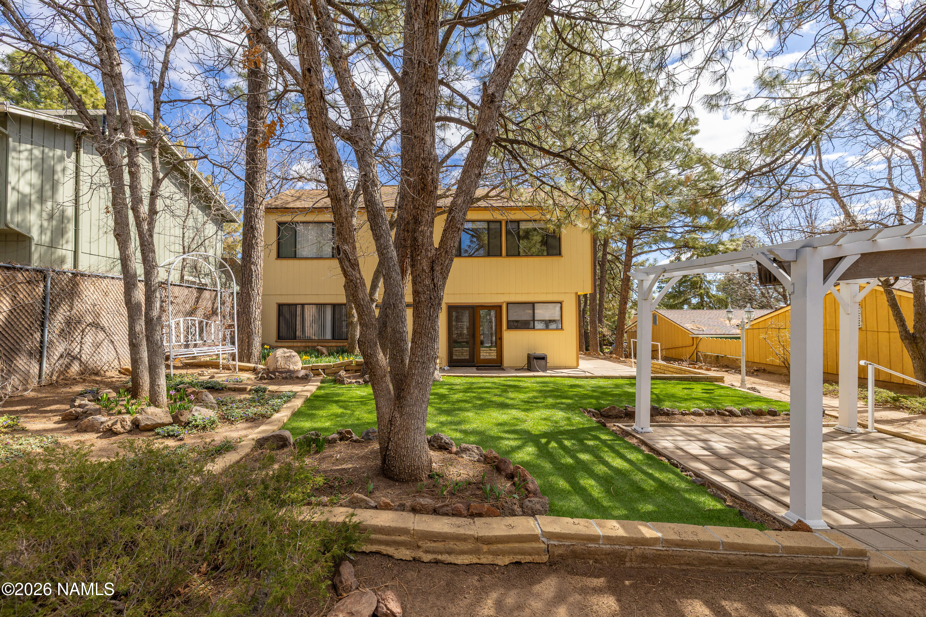 3971 North Swiss Road Flagstaff, AZ 86004 - Photo 5 of 43 a view of a house with a yard