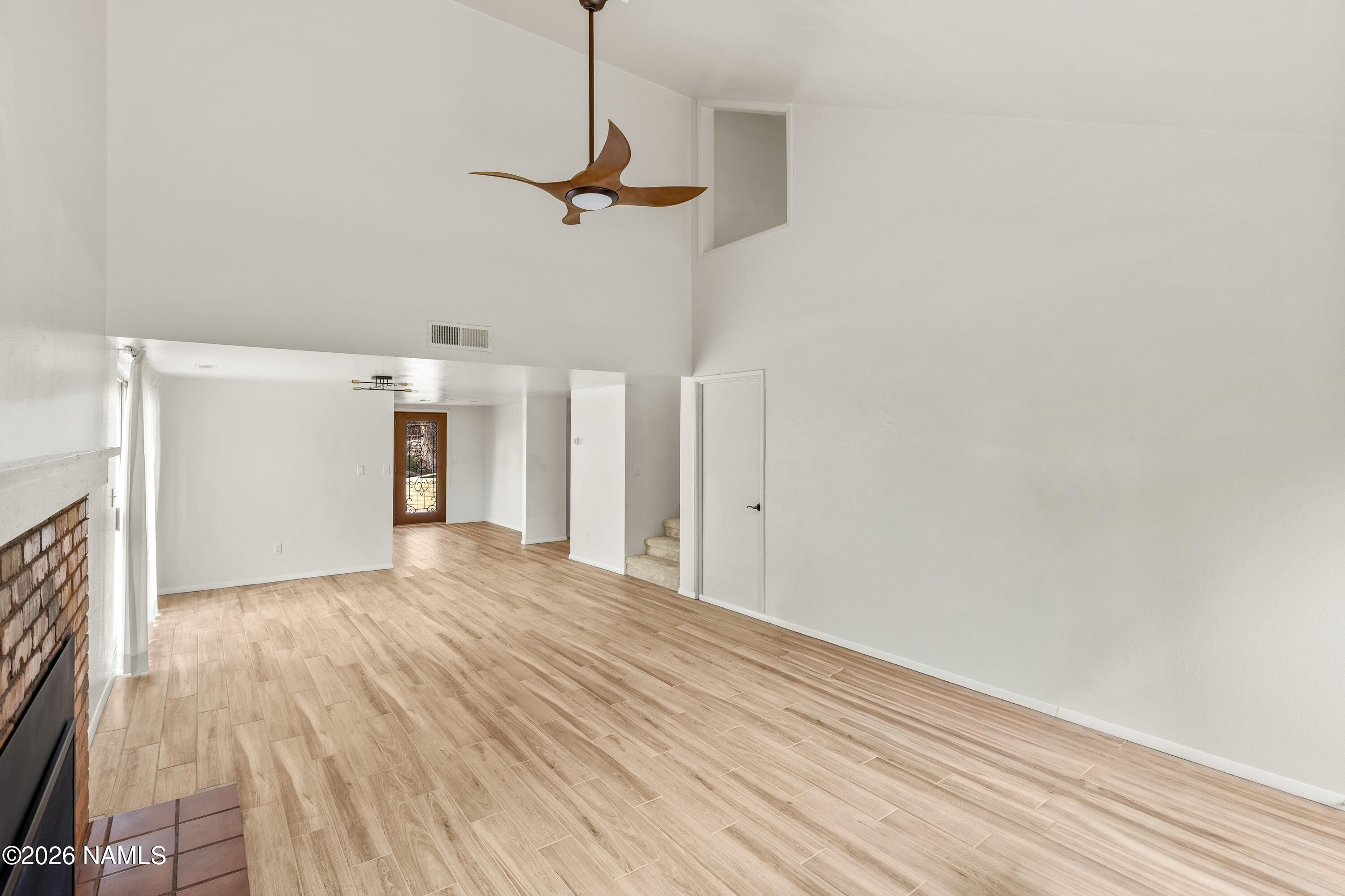 3971 North Swiss Road Flagstaff, AZ 86004 - Photo 10 of 43 a view of empty room with wooden floor