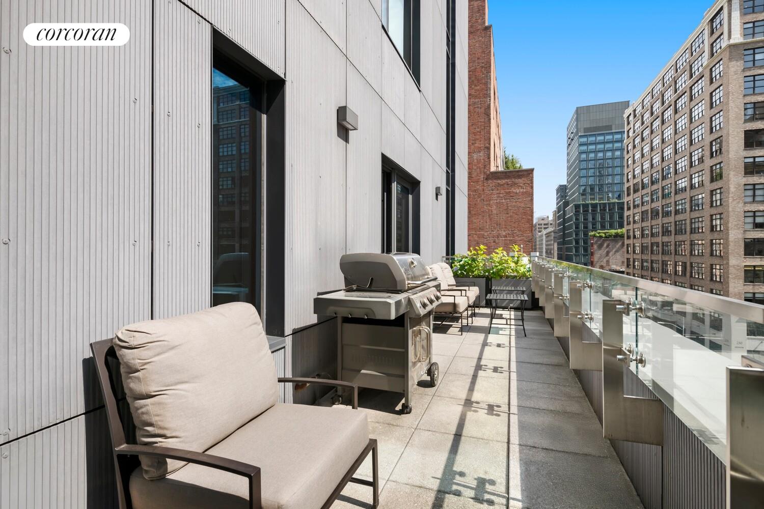 219 Hudson Street, Unit 6D Manhattan, NY 10013 - Photo 10 of 16 a view of a patio with couple of chairs and a potted plant