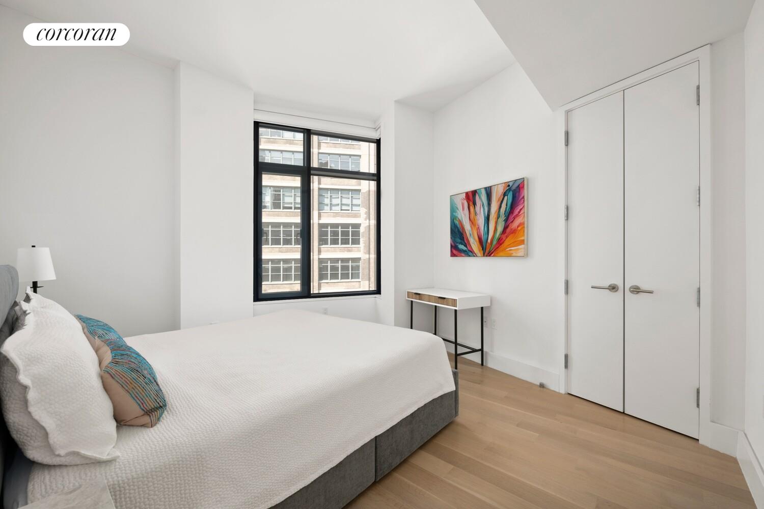 219 Hudson Street, Unit 6D Manhattan, NY 10013 - Photo 11 of 16 a bedroom with a bed and a window