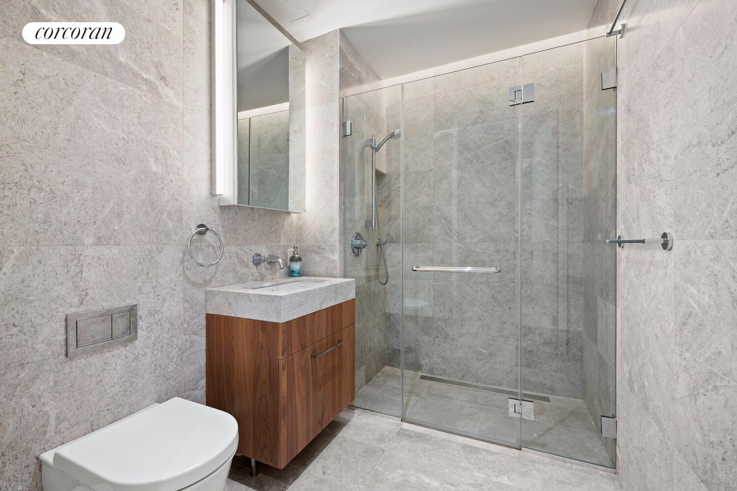 219 Hudson Street, Unit 6D Manhattan, NY 10013 - Photo 14 of 16 a bathroom with a sink a toilet and shower