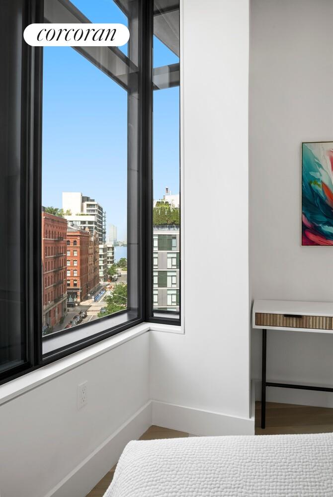 219 Hudson Street, Unit 6D Manhattan, NY 10013 - Photo 15 of 16 a view of a room that has a bed and a window