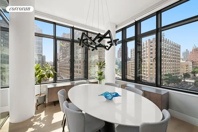 a kitchen with a table chairs sink and cabinets