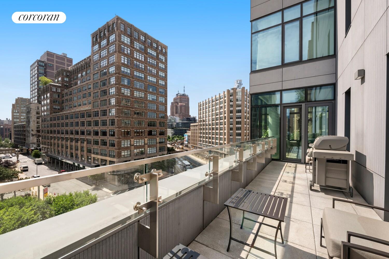 219 Hudson Street, Unit 6D Manhattan, NY 10013 - Photo 4 of 16 a view of a building with large windows