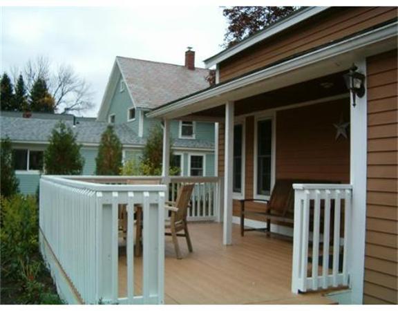 91 Ryan Road Northampton, MA 01062 - Photo 17 of 24 a view of a house with a backyard and a chair