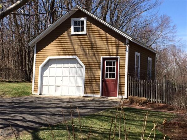 91 Ryan Road Northampton, MA 01062 - Photo 23 of 24 a front view of a house with a garden