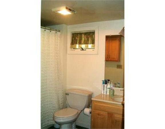 91 Ryan Road Northampton, MA 01062 - Photo 8 of 24 a bathroom with a toilet a sink and mirror