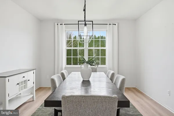 a bedroom with furniture and a flat screen tv