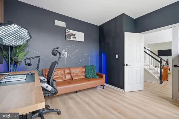 a bedroom with a bed and a couch