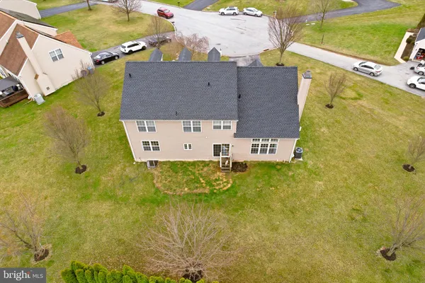 an aerial view of residential house with swimming pool
