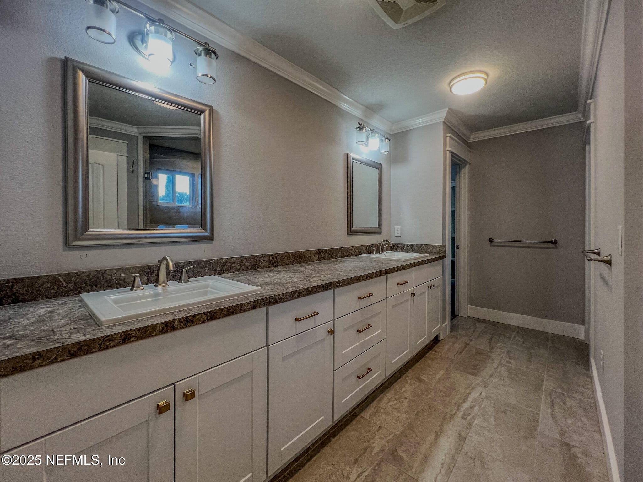 4325 Appleton Avenue Jacksonville, FL 32210 - Photo 17 of 40 a bathroom with a granite countertop sink mirror and double