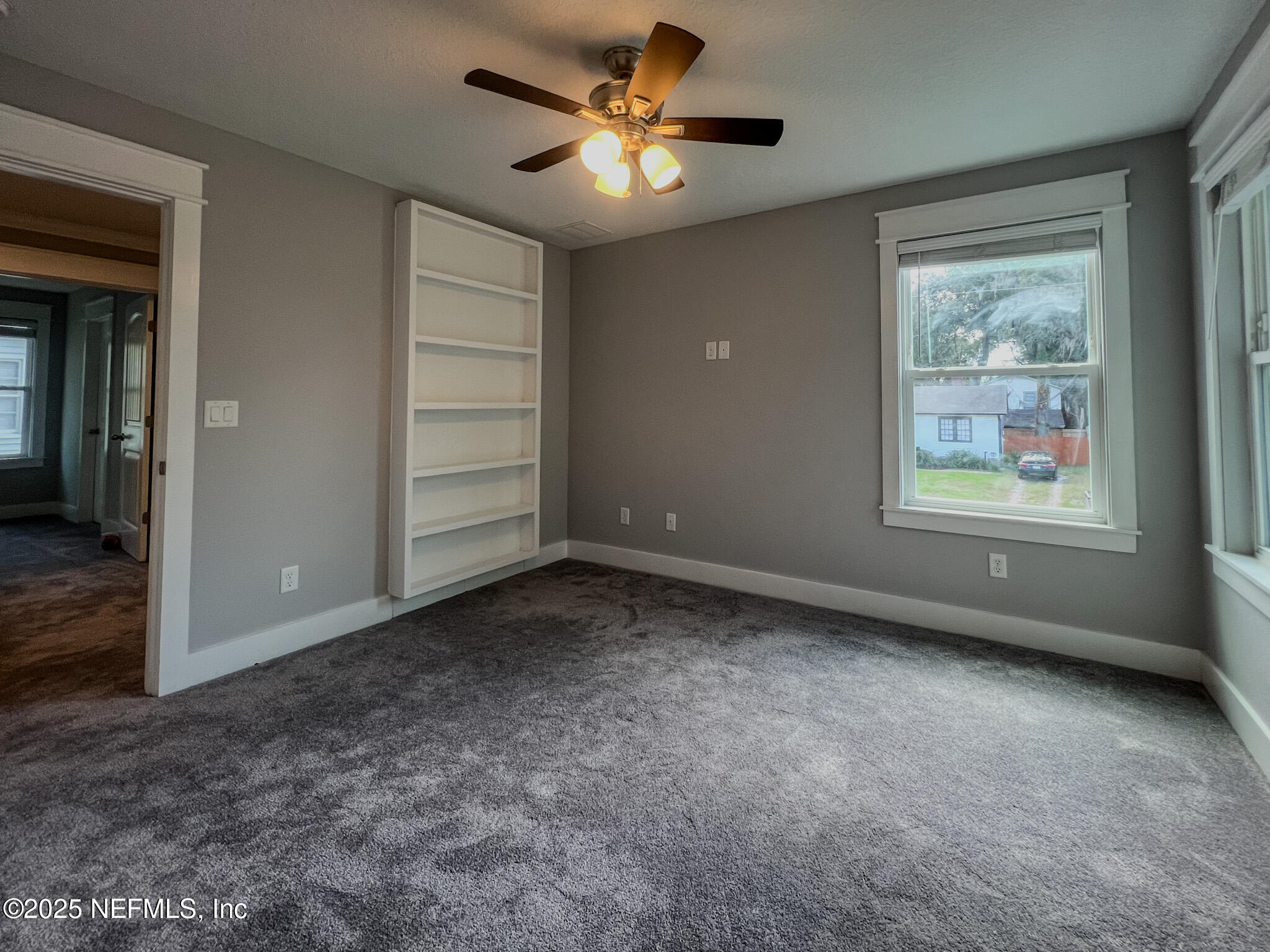 4325 Appleton Avenue Jacksonville, FL 32210 - Photo 23 of 40 an empty room with windows and fan