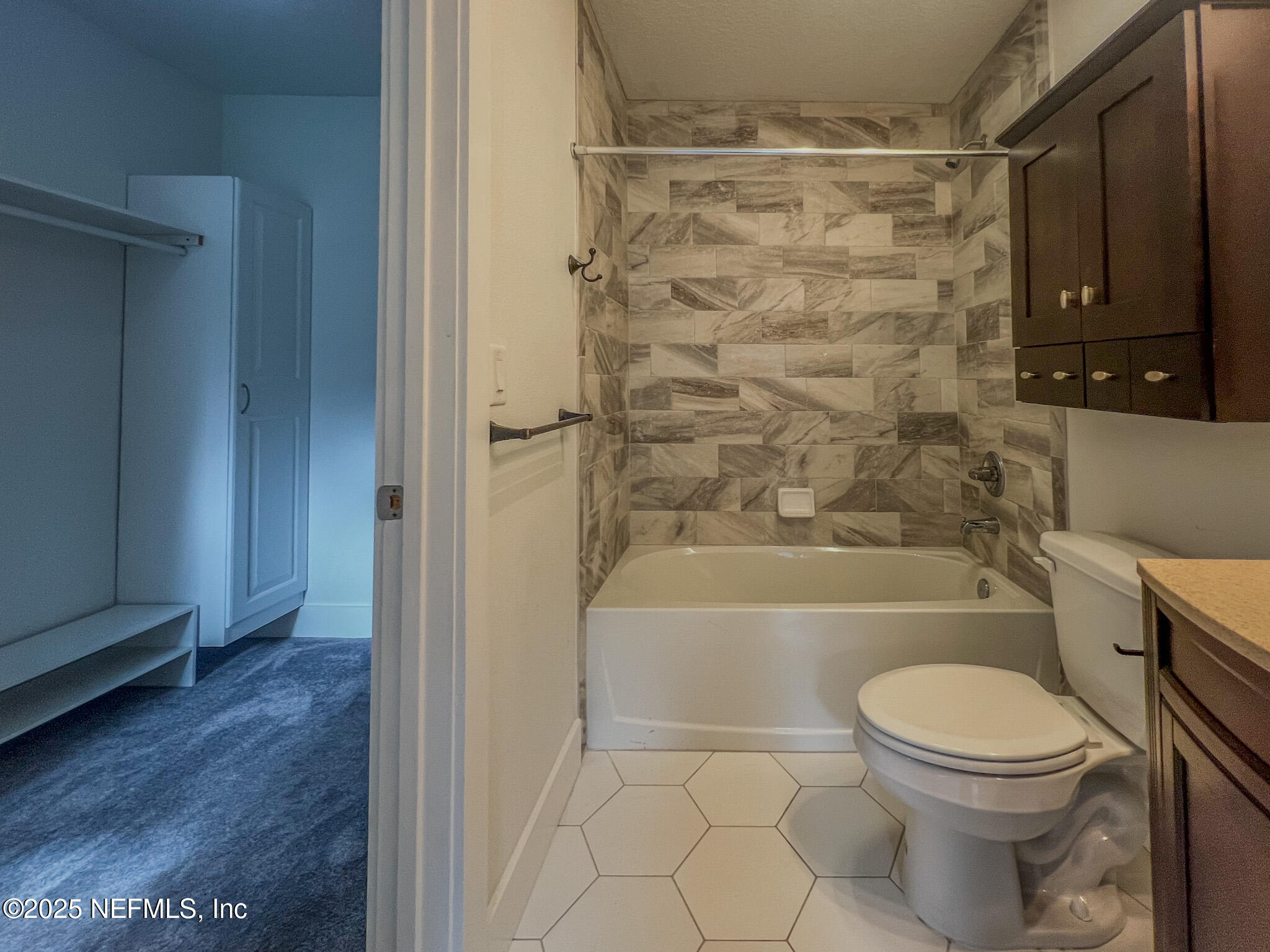 4325 Appleton Avenue Jacksonville, FL 32210 - Photo 26 of 40 a bathroom with a toilet and a shower