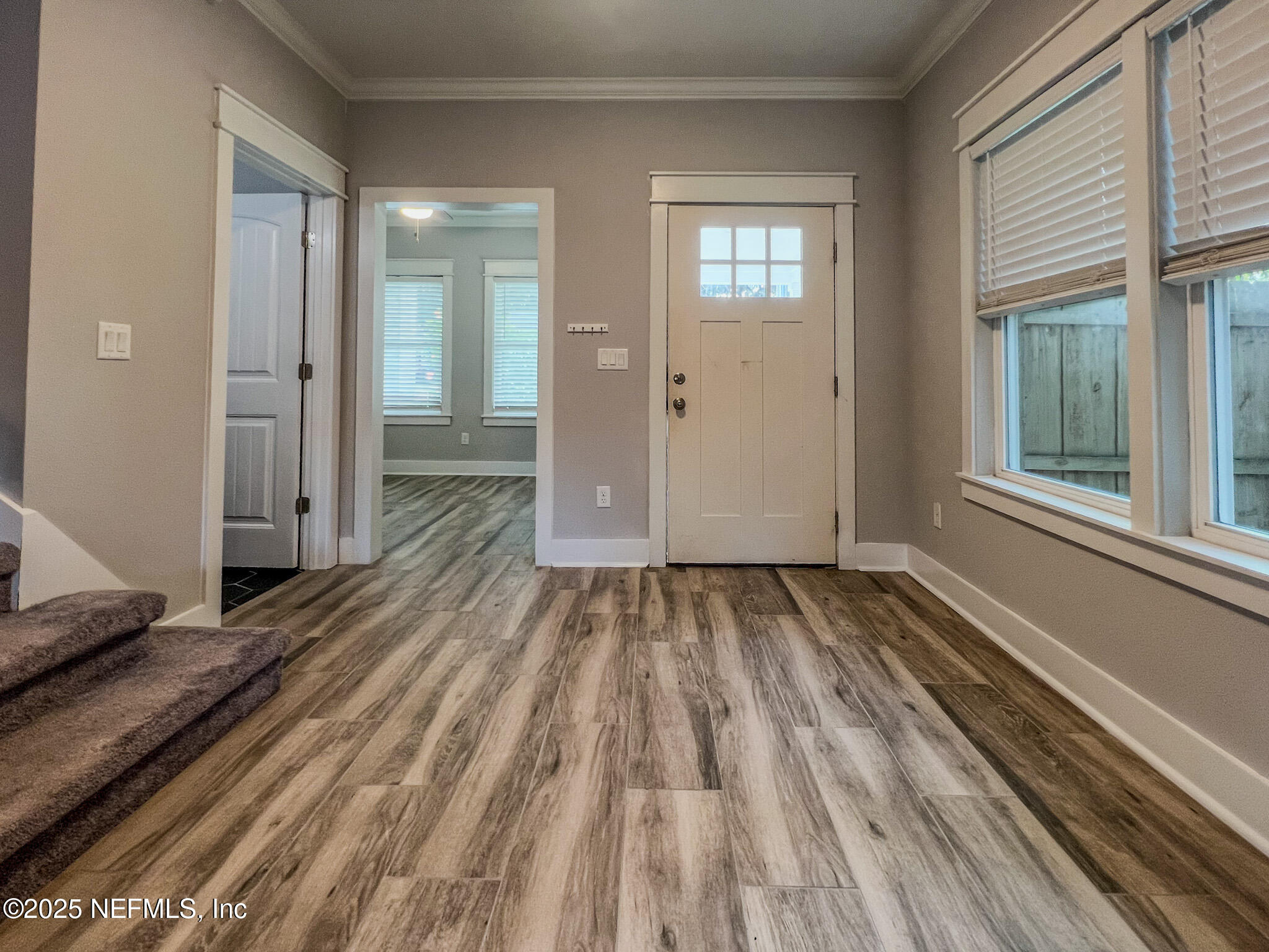 4325 Appleton Avenue Jacksonville, FL 32210 - Photo 3 of 40 a view of a room with wooden floor and two windows