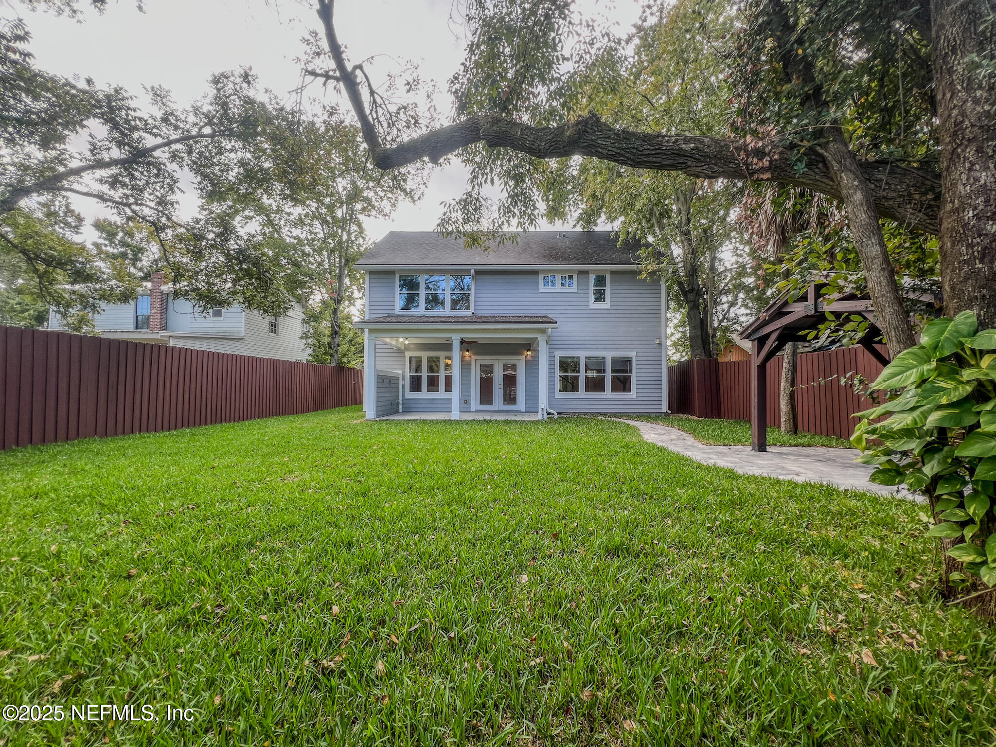4325 Appleton Avenue Jacksonville, FL 32210 - Photo 38 of 40 a view of a house with a yard and tree s