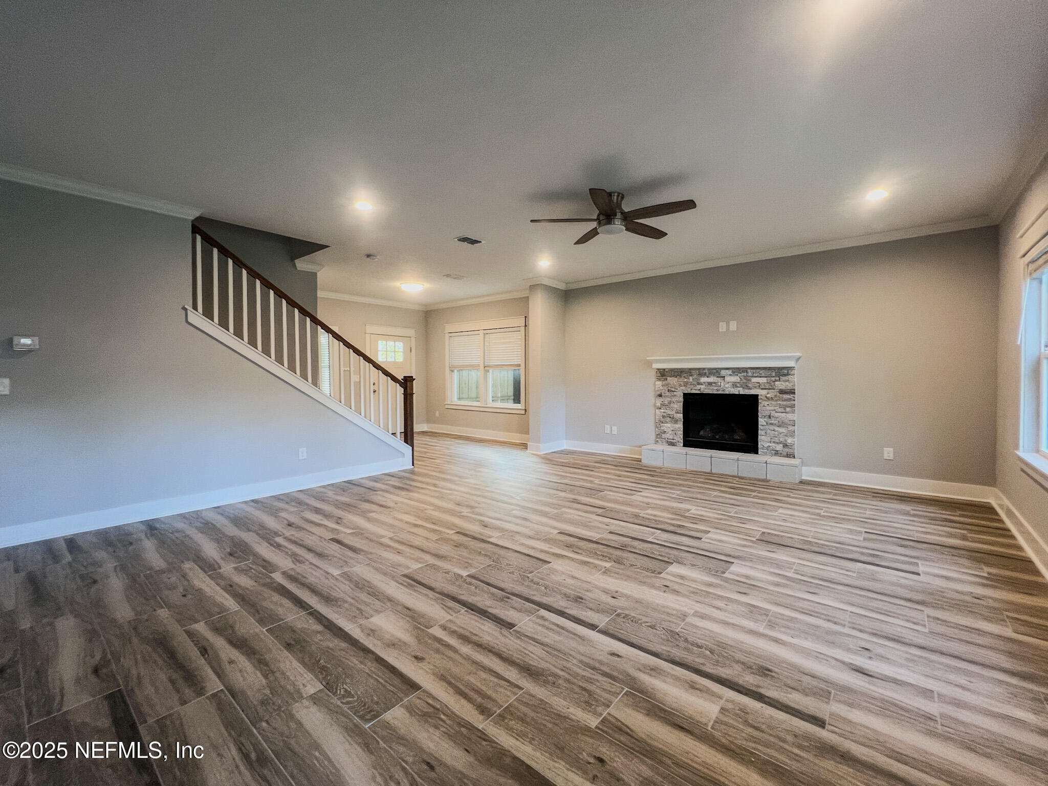 4325 Appleton Avenue Jacksonville, FL 32210 - Photo 4 of 40 a view of empty room with wooden floor and fireplace