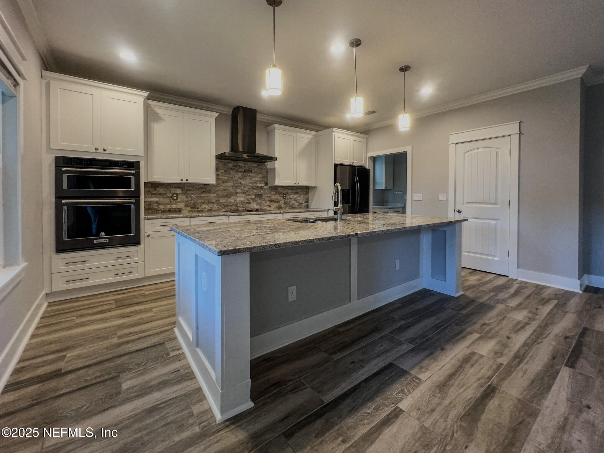 4325 Appleton Avenue Jacksonville, FL 32210 - Photo 7 of 40 a large kitchen with kitchen island a sink stainless steel appliances and cabinets