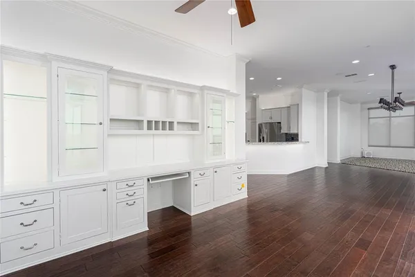 a view of an empty room with a fireplace and a window
