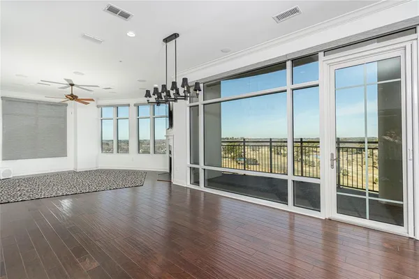 a living room with a fireplace furniture and a flat screen tv