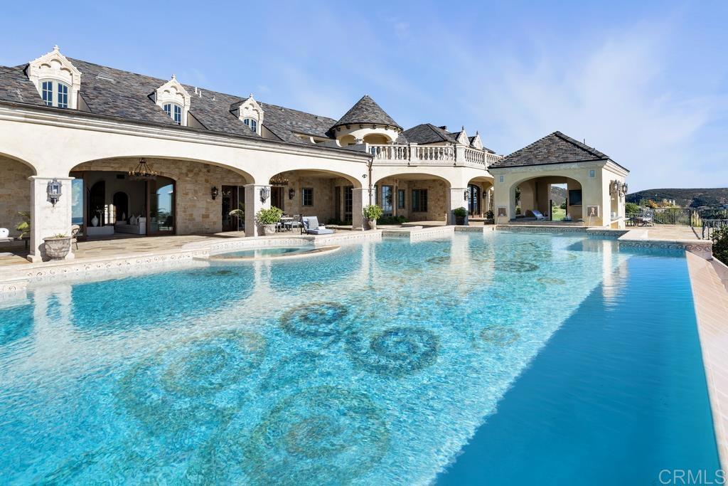 18441 Via Ambiente Rancho Santa Fe, CA 92067 - Photo 1 of 35 a front view of a house with garden