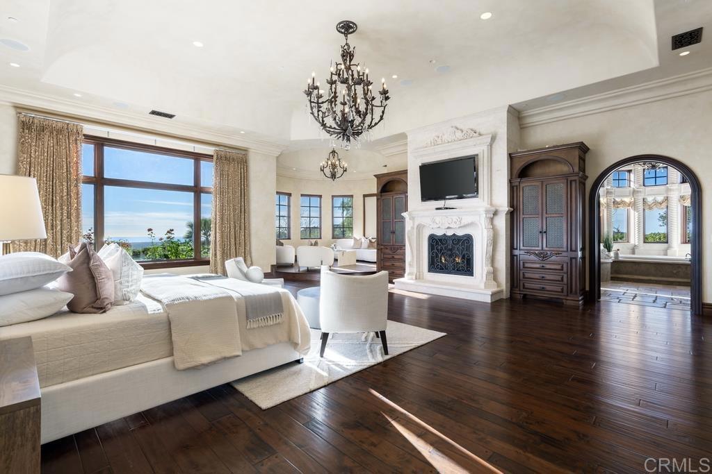 18441 Via Ambiente Rancho Santa Fe, CA 92067 - Photo 15 of 35 a living room with fireplace furniture and a flat screen tv