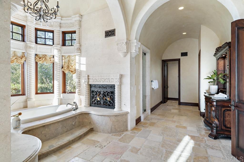 18441 Via Ambiente Rancho Santa Fe, CA 92067 - Photo 17 of 35 a spacious bathroom with a tub and shower