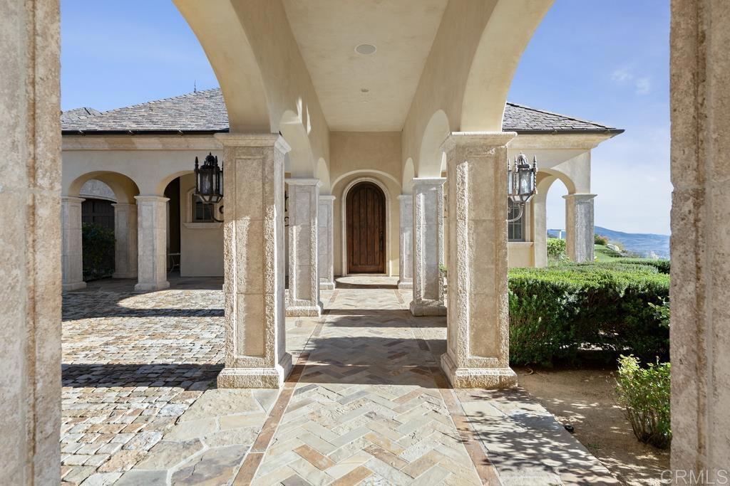 18441 Via Ambiente Rancho Santa Fe, CA 92067 - Photo 21 of 35 a view of a house with a door and balcony