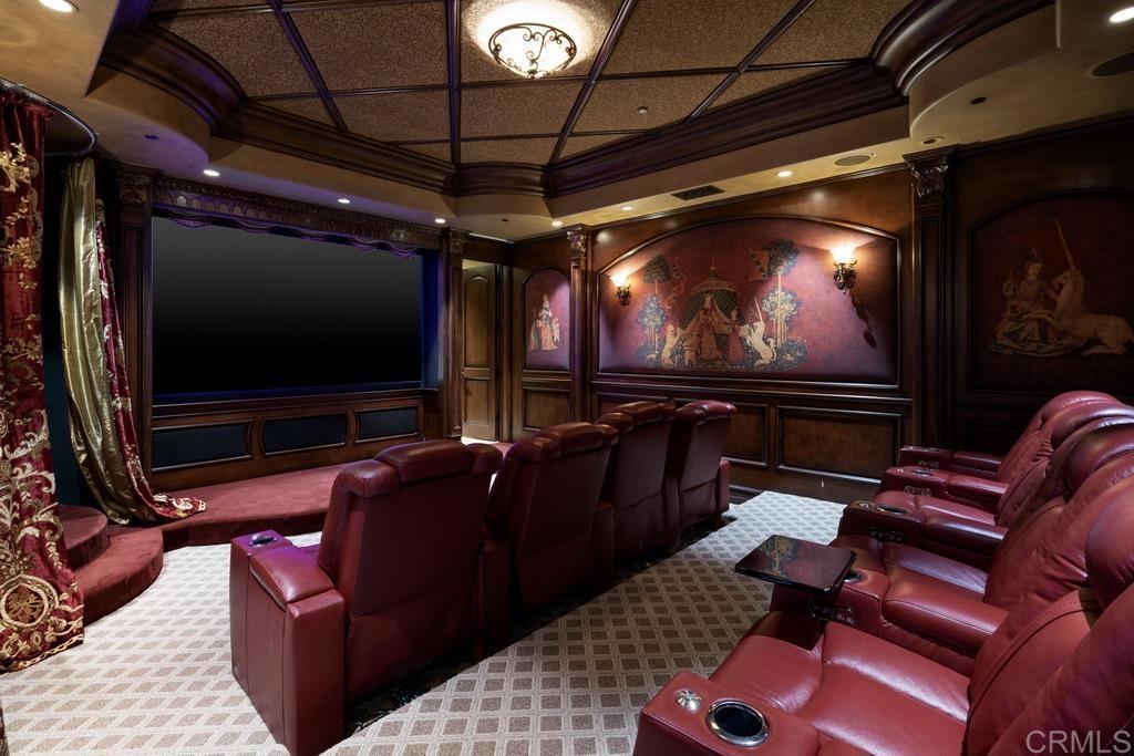 18441 Via Ambiente Rancho Santa Fe, CA 92067 - Photo 22 of 35 a living room with furniture and a projector screen