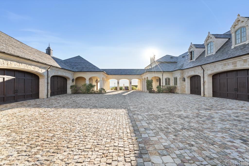18441 Via Ambiente Rancho Santa Fe, CA 92067 - Photo 24 of 35 a front view of a house with a yard