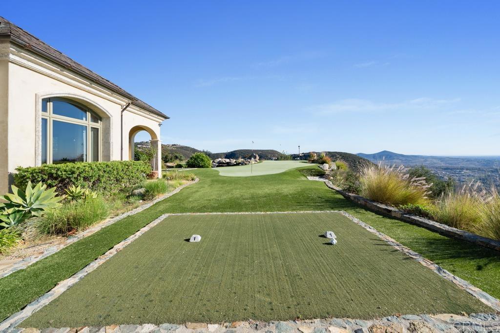 18441 Via Ambiente Rancho Santa Fe, CA 92067 - Photo 25 of 35 a view of a house with a yard