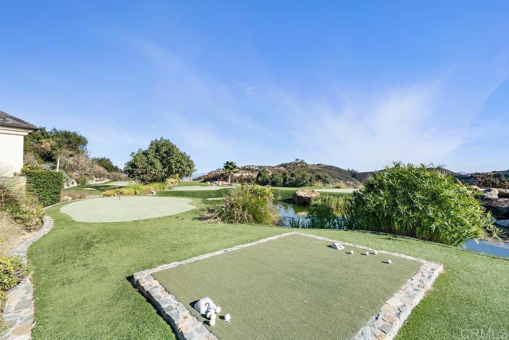 18441 Via Ambiente Rancho Santa Fe, CA 92067 - Photo 26 of 35 a view of a pool with a yard
