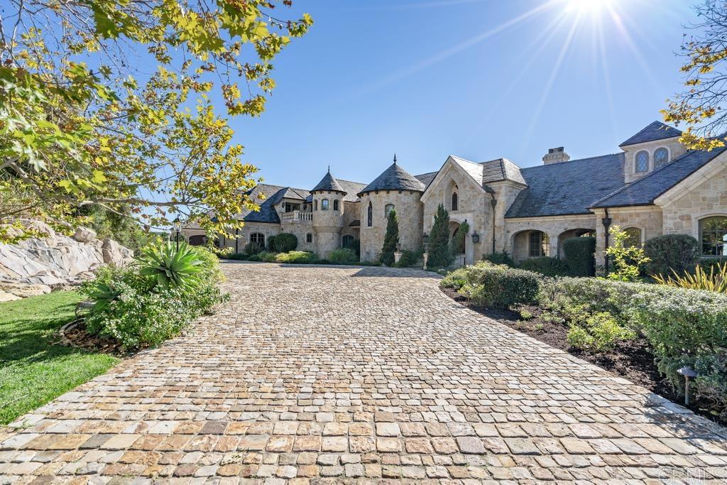18441 Via Ambiente Rancho Santa Fe, CA 92067 - Photo 3 of 35 a view of a garden with a house