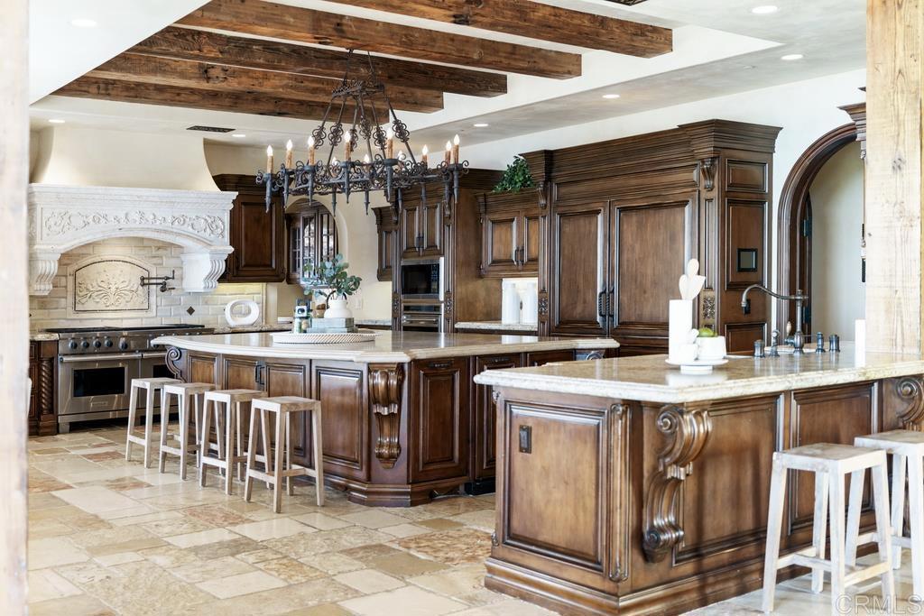 18441 Via Ambiente Rancho Santa Fe, CA 92067 - Photo 7 of 35 a kitchen with a sink and cabinets