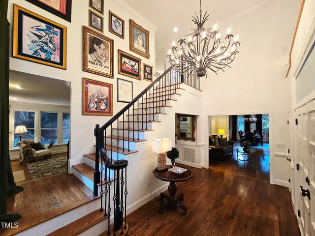 a bedroom with a bed and a ceiling fan
