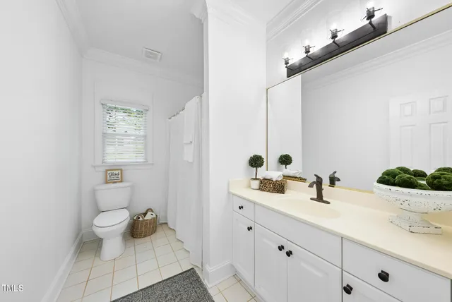 a bed room with a bed and a window